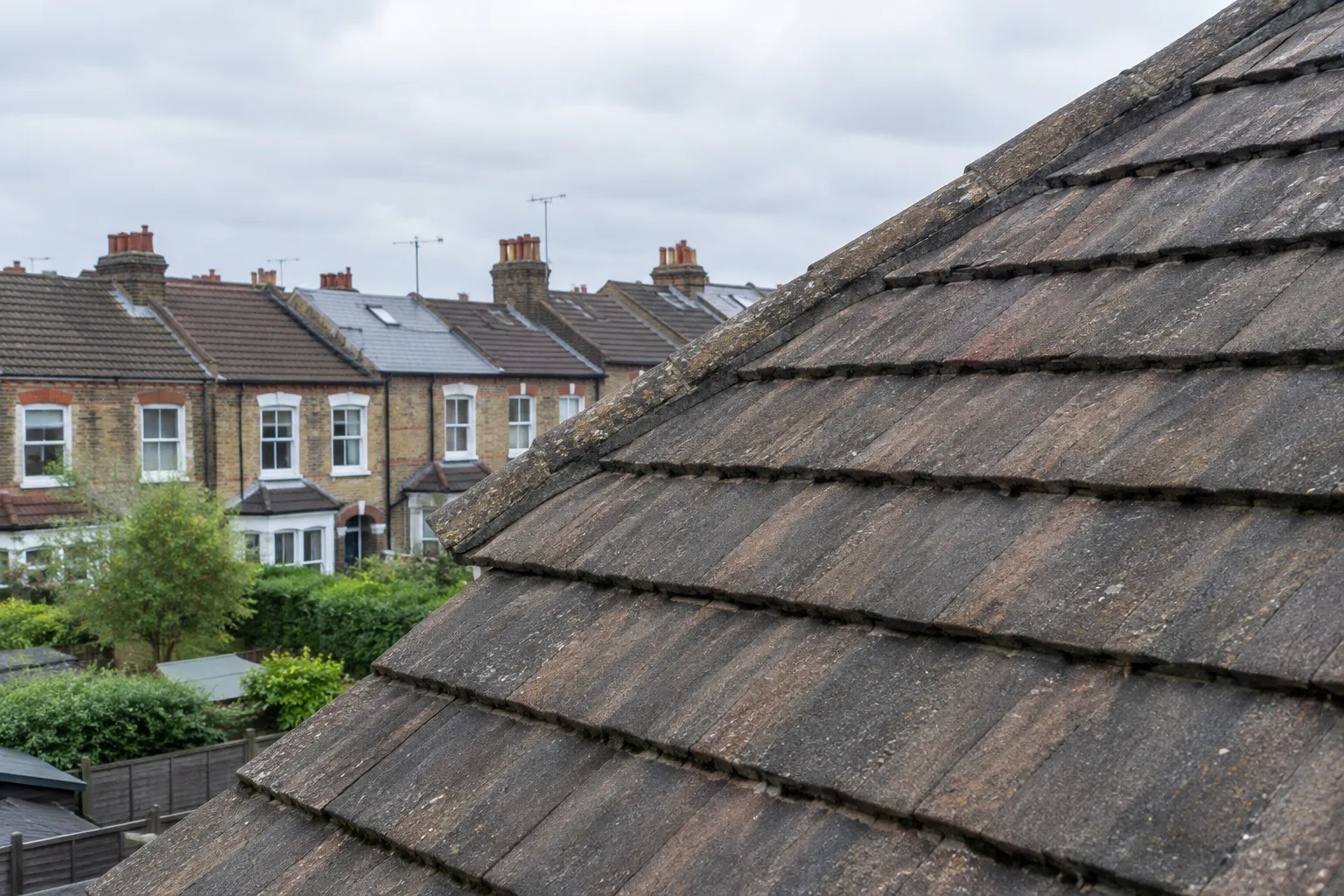 Close-up of overlapping concrete roof tiles
